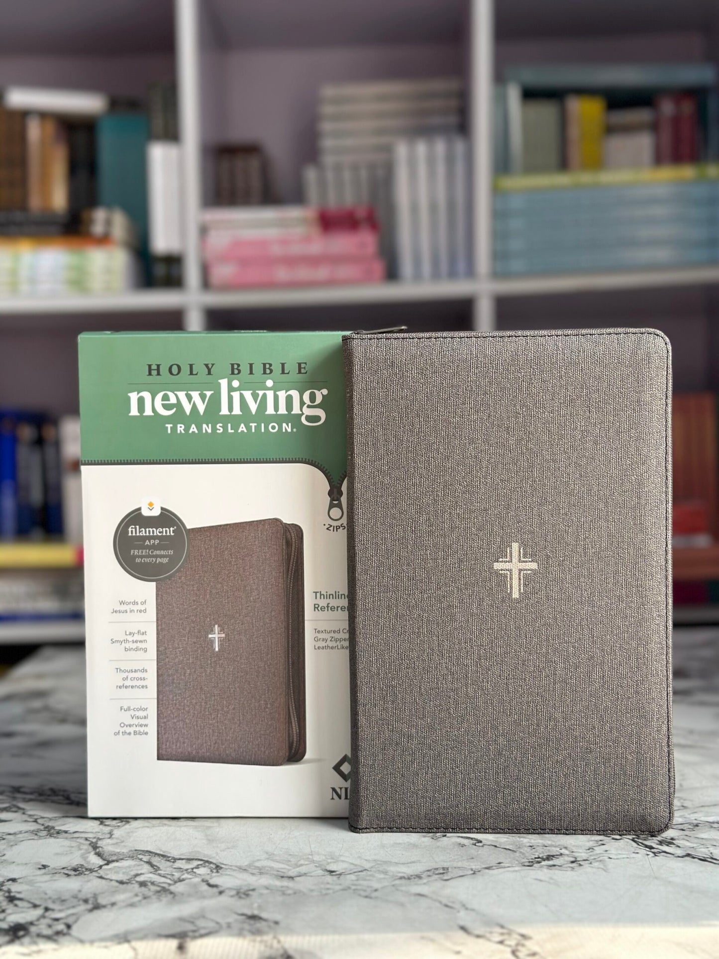 NLT Thinline Reference Zipper Bible, Filament Enabled LeatherLike, Textured Cross Gray, Red Letter