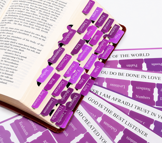 Purple bookmark labels on an open book with text